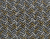 gold and white silver gauze fa: Patterned see through fabric on black background.  Gold and silver thread in a brick-like herringbone pattern