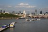 River Thames, London: A view from the south bank of the River Thames as it passes through central London, England. St Paul's cathedral and other landmarks are visible.