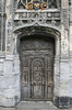 Ancient door: An old wooden door in the perimeter wall of Canterbury Cathedral, Kent, England.