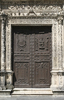 Ancient carved door: An ancient ornate carved door in Seville, Spain.
