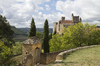 Castle grounds: A public path alongside the grounds of a castle in the Dordogne, France.