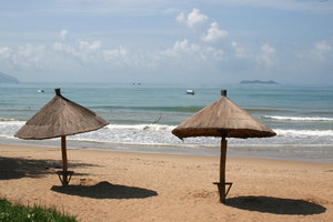 Beach umbrellas: Sun umbrellas on a beach on the southern shore of Hainan Island, China.
