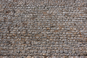 Stone wall background: Part of an old defensive stone wall in Ibiza, Spain.