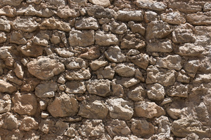 Stone wall background: A rough old stone wall in Ibiza, Spain.