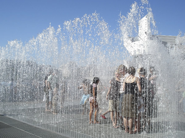 Fun fountains: Youngsters enjoying a fun fountain installation in London, England, on a hot summer day.