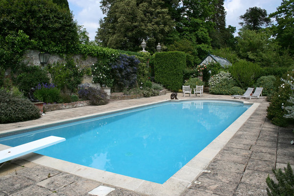 Swimming pool: A swimming pool in the garden of a stately house in East Sussex, England.