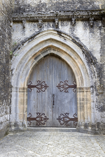Church door: Door to a church in the grounds of a castle in the Dordogne, France.