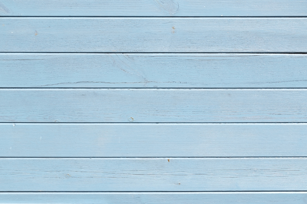 Blue wood texture: Blue wooden panelling on a house in England.