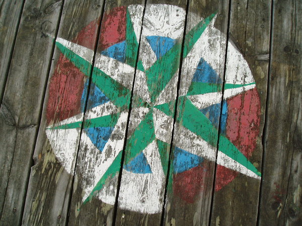 Compass rose: Compass rose painted on an old bridge, now demolished.