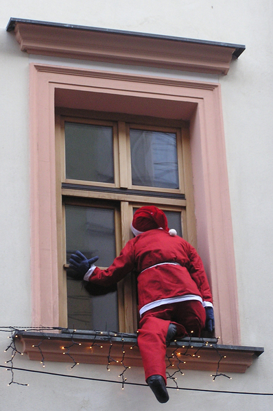Santa Claus: Santa Claus coming through the window.