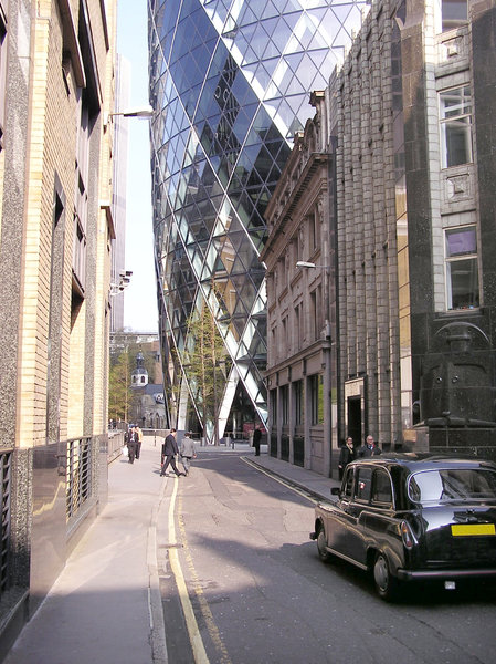Gherkin: A wolrd famous building in London. 30 St Mary Axe also known as Swiss Re Building.