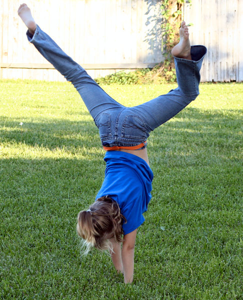 Handstand: 8 year old standing on her hands