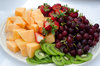 Fruit tray: Small fruit tray with kiwi, strawberries, melon and grapes