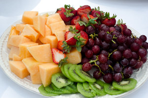 Fruit tray: Small fruit tray with kiwi, strawberries, melon and grapes