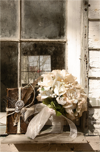 Bouquet and book: Bouquet in the window of an old Southern building