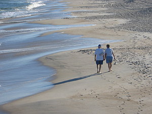 Later Walk: Couple enjoying the beach.