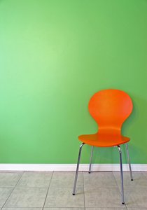 Green Wall 2: Orange chair in front of a green wall.