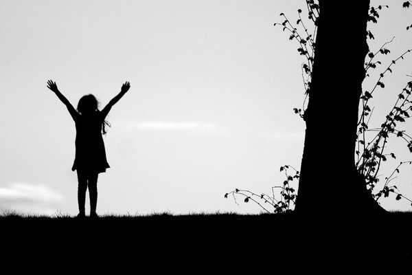 Girl Silhouette: Silhouette of happy young girl