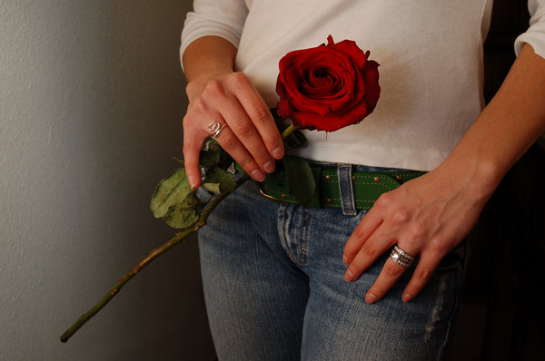 Rose: Tammy holding a single long stem rose.