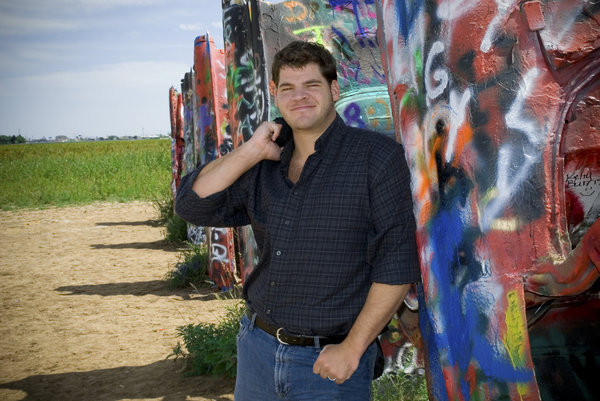 Me: Myself standing beside the famous Cadillac Ranch.  I took this photo for my mom.  I was asked to make new photos of myself and my siblings for her to put up on her living room wall.  I have really small eyes don't I?
