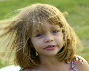 Child in the wind: young child with hair  blowing in the wind 