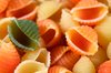 Odd Pasta Out: Conchiglie pasta with a single green shell to contrast against all the yellows and oranges.