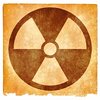 Nuclear Grunge Sign: Grunge textured nuclear symbol on vintage paper, with sepia toning for a more aged feel.