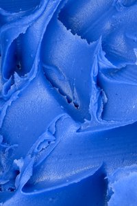 Blue Icing Texture: Macro peanut butter texture colorized blue to simulate icing on a cake.