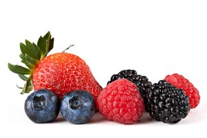 Berry Mix: Mix of strawberry, blueberries, raspberries, and blackberries isolated on a white background.