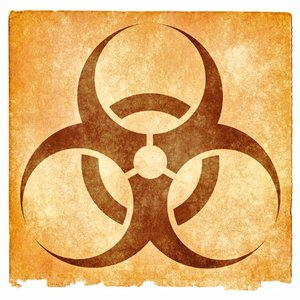 Biohazard Grunge Sign: Grunge textured biohazard symbol on vintage paper, with sepia toning for a more aged feel.