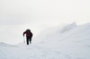 Mountaineering in Scotland: A man climbing a snowy mountain in Scotland