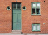 door and windows: Unusually tall door with various windows captured in Lund, Sweden.