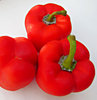 sweet red peppers: fresh bright red capsicums - red peppers