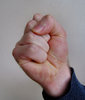 clenched fist1: man's tightly clenched fist