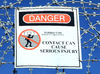 sharp warning: sign warning of the danger of razor wire