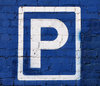 blue wall parking: parking area sign on blue wall