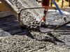 concrete pour6: concrete being poured to form a foundation concrete pad