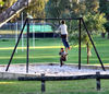 in the swing of things3: boys playing on suburban playground swings