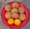 mandarin muffins1: plate of freshly baked mandarin flavoured muffins - cupcakes