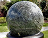 water rotating sphere1: 10 tonne kugel-ball of brecciated marble and granulitic schist floating on water on black granite base