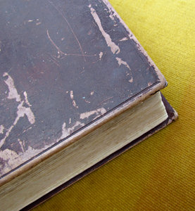 old books: scuffed cover and corner of old book