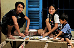 Cambodian lunch: a family eatring lunch at home in Cambodia