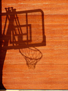 shadowy game: shadow of mobile basketball board and hoop/basket