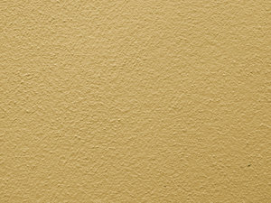 cream wall surface: cream coloured textured wall
