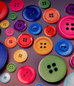 button background1: a variety of different sized, shaped and coloured buttons covering interior wall background
