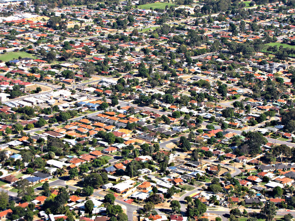down in the suburbs: looking down on Australian suburbs through airplane window