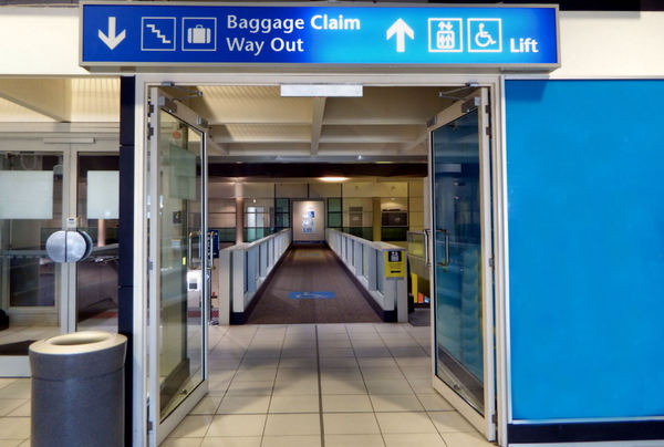 airport exit1: airport exit doors and pedestrian overpass