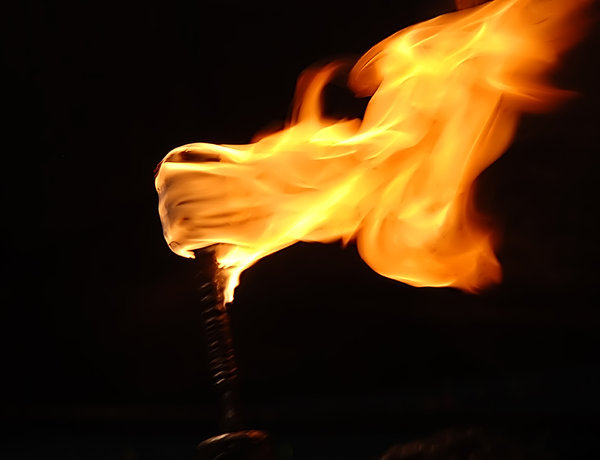 Torch: The interesting thing about this shot is that the flames take the shape of a hand clutching the rod. Four fingers on the top with the thumb pointing south.