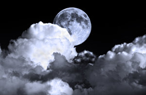 Night Sky: Full moon in a cloudy night sky
