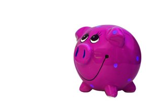 Pink Piggy Bank: A colourful, smiley piggy bank.  Lots of copy space.